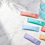 7 Quick Hydration Drink That Actually Work in 2026 (Tested & Compared) Instant Hydration reviews — electrolyte drink packets and prepared drink on marble surface